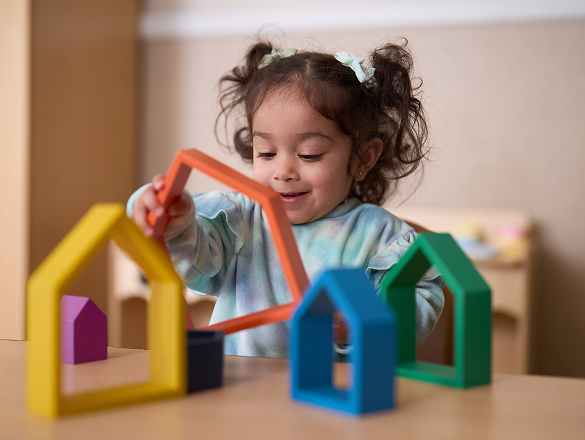 Image of a child playing with shapes
